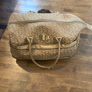 CK carry on rolling travel bag